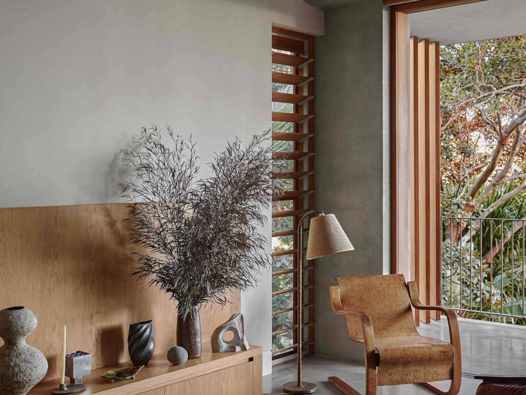 Custom timber louvre window in the corner of a contemporary Palm Beach living room