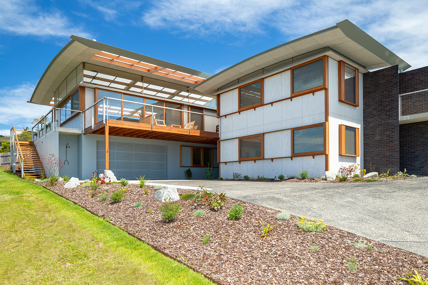 Face-sliding windows in Blackbutt on a contemporary barestone beach house