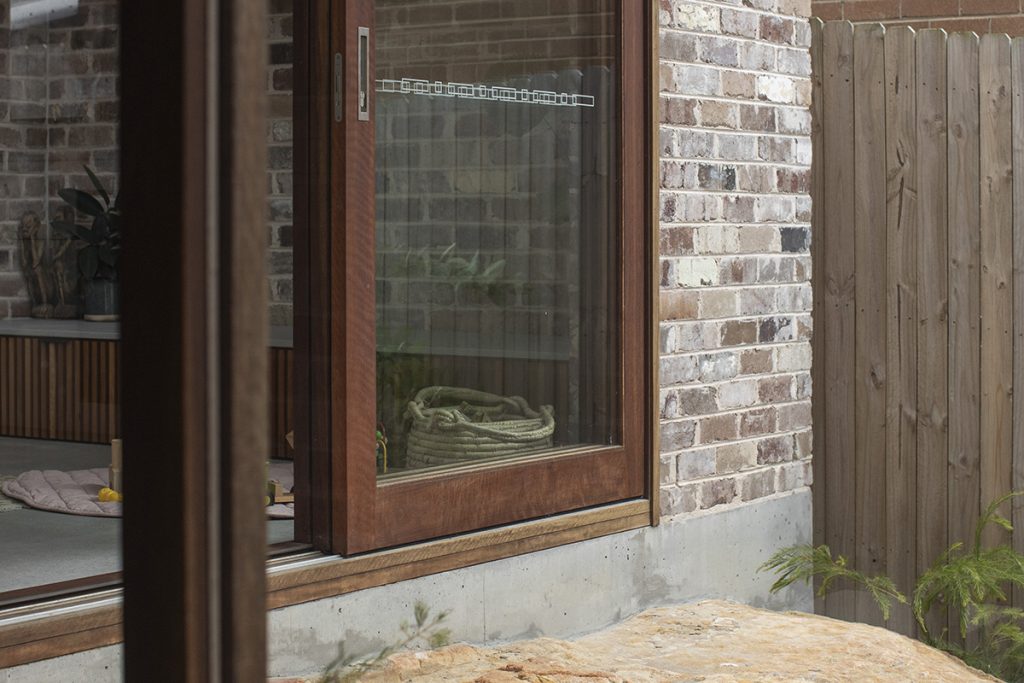 Detail of sliding stacker doors in Spotted Gum
