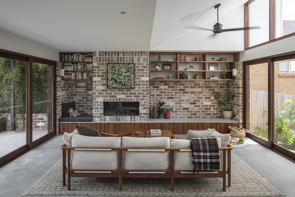 Modern lounge room with sliding doors and fixed highlight windows in Spotted Gum by Acacia.