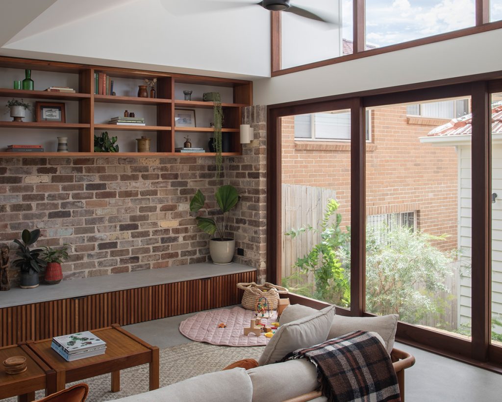 Sliding doors and high fixed windows in Spotted Gum at Re-Grow/Re-Wild House by Bastian Architecture